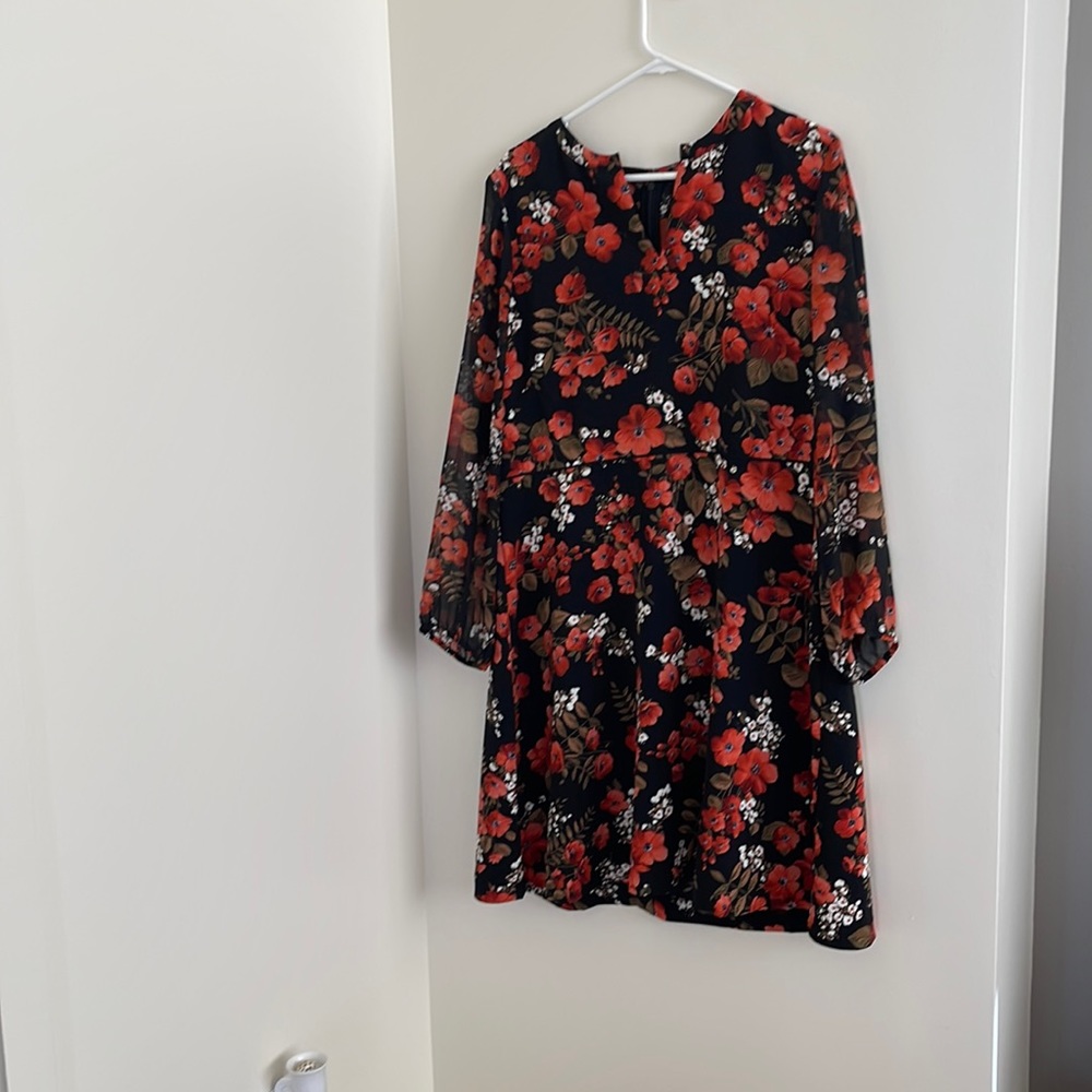 Knee length dress black with orange flowers.